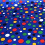 Carnival satin fabric - small multicolored dots on blue background